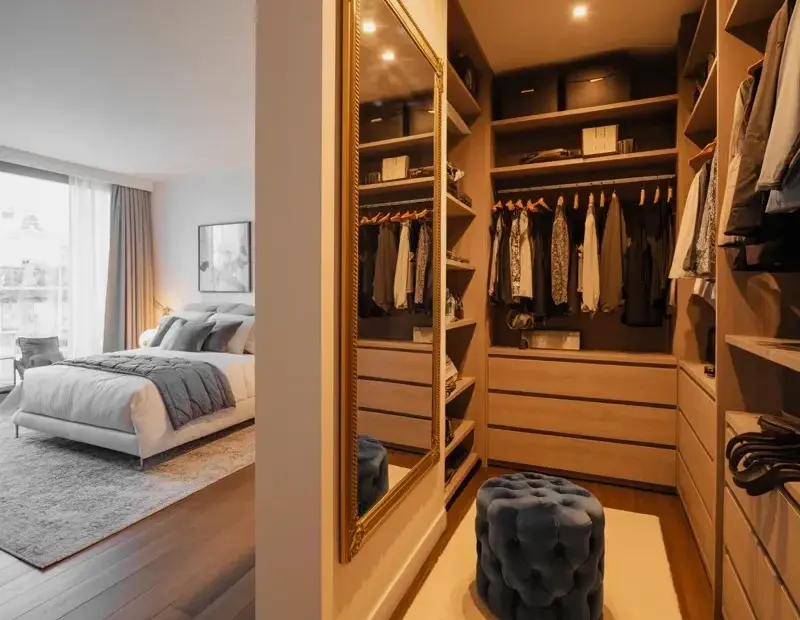 Walk-In Closet and Bedroom Combo Ideas with Light Oak Built-Ins